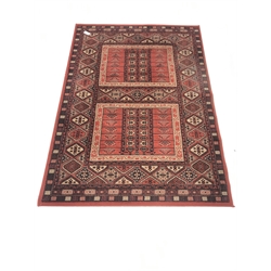 Persian design red ground rug, repeating border, 190cm x 137cm