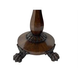 Victorian mahogany tea table, rectangular top with rounded corners, folding and swivelling to reveal interior surface, supported on a faceted baluster-shaped column, raised on a circular platform base with carved acanthus details, ending in four lion paw feet