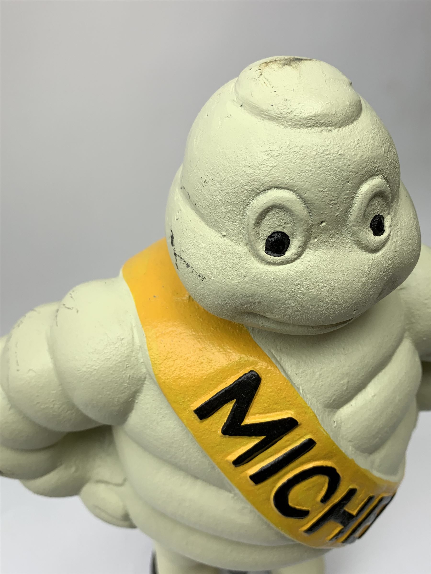 A cast iron Michelin man type figure, H40cm.