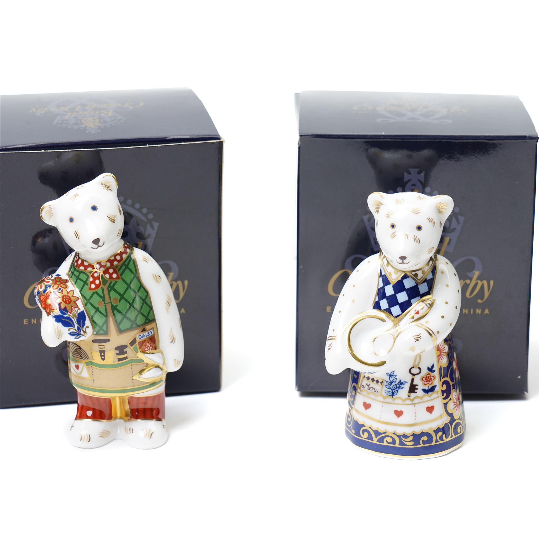 Set of eight Royal Crown Derby teddies, comprising cook, shopping, Daddy and George, Mummy and Charlotte, gardener, school boy, Xmas and Scottish teddy, no stoppers, all boxed (8)