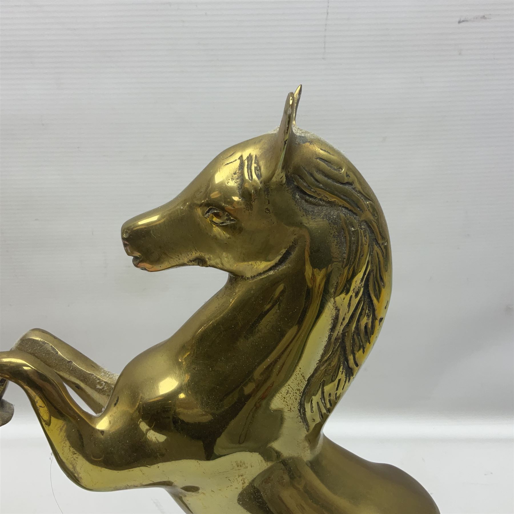 Two brass animals, the first example modelled as a rearing the horse and the other as an elephant, tallest H40cm