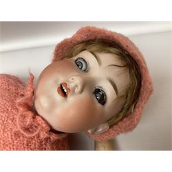 Armand Marseille bisque head doll with applied hair,sleeping eyes, oen mouth with upper teeth and composition body with jointed limbs; marked ' Armand Marseille Germany 390 A.7.M.' H62cm