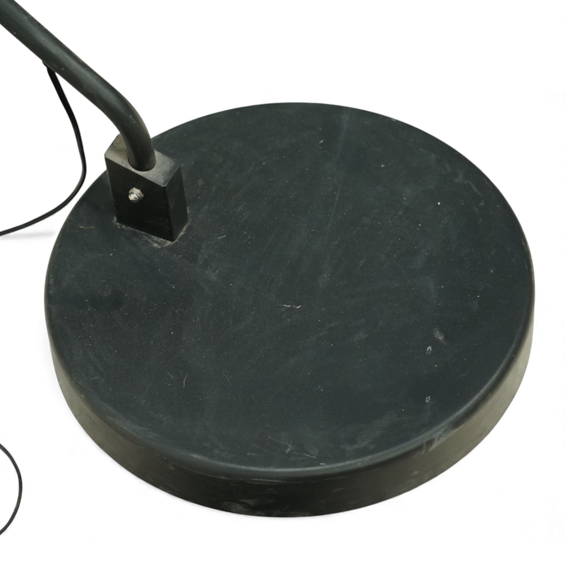 Contemporary black painted floor lamp, domed black shade with gold leaf effect interior, on a circular weighted base