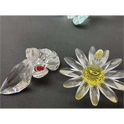 Swarovski Crystal flowers and butterflies, to include two tulip displays on stands, three vases of flowers and eight coloured butterflies, etc 