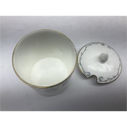 Coalport Revelry pattern tea and dinner wares, comprising nine dinner plates, four salad plates, eleven side plates, sauce boat and stand, ten teacups and ten saucers, and preserve pot and cover, together with a Coalport plate of shaped form decorated with pink roses, and a Royal Crown Derby Royal Antoinette pattern trio