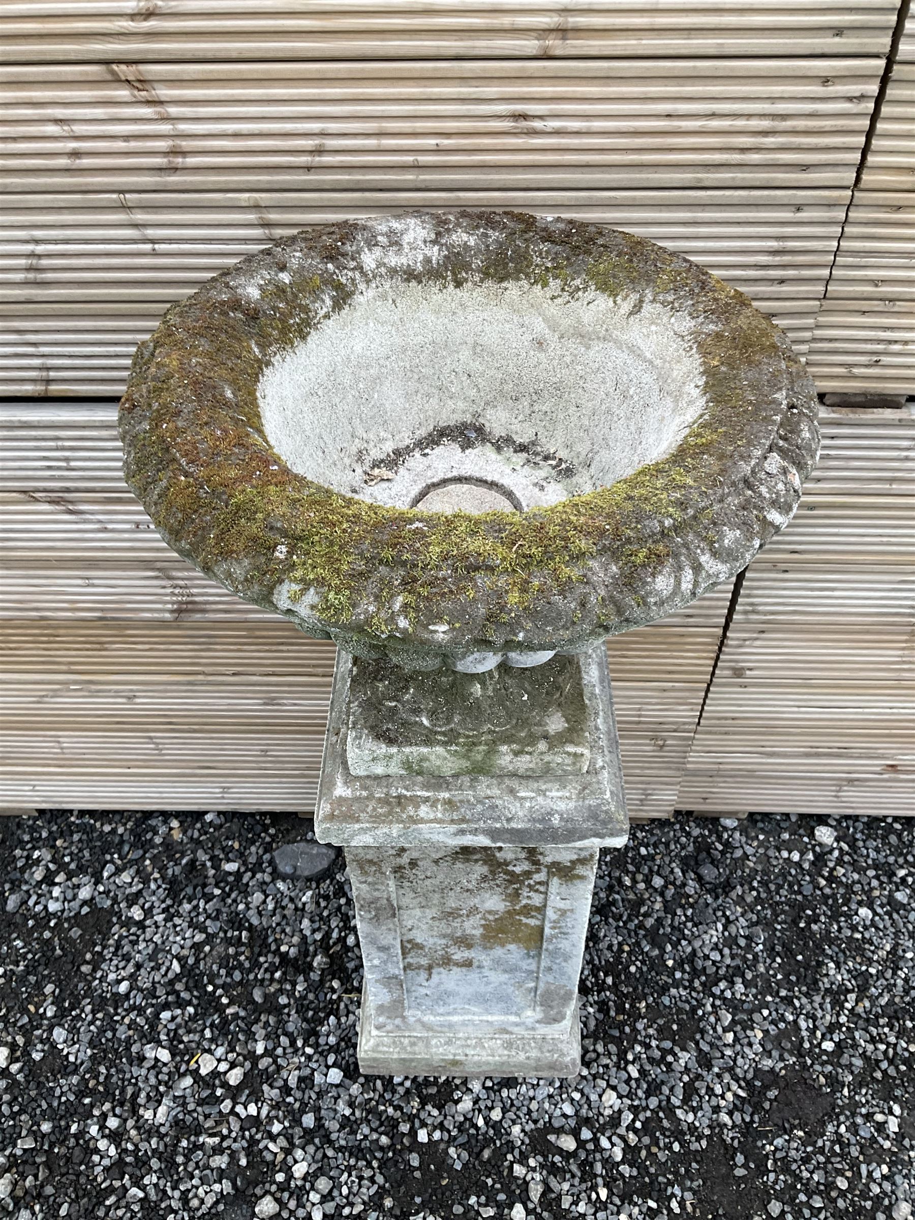 Cast stone urn on plinth, on tall square plinth - THIS LOT IS TO BE COLLECTED BY APPOINTMENT FROM DUGGLEBY STORAGE, GREAT HILL, EASTFIELD, SCARBOROUGH, YO11 3TX