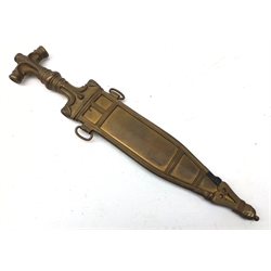  Late 19th century Eastern brass dagger, 23cm twin edge tapering steel blade, brass hilt cast with scrolls, shaped grip and T shaped pommel, L35.5cm, brass scabbard cast with crescents and with silk panel front,   