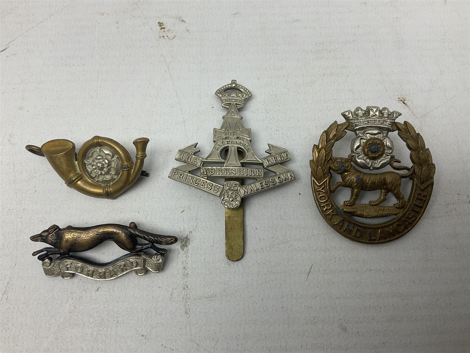 South African Army Orange Free State Artillery badge; three Commonwealth badges; and twelve Yorkshire/Lincolnshire badges including East Yorkshire, West Riding, York and Lancaster, West Yorkshire etc (16)