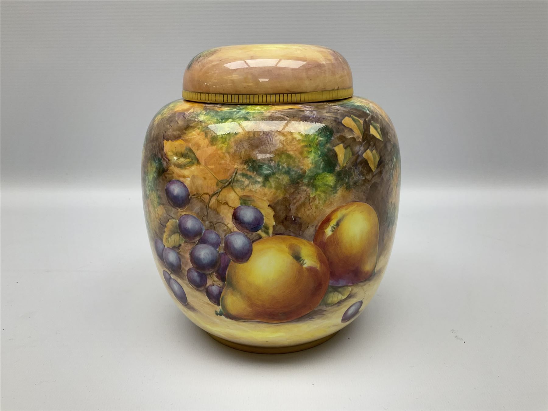Mid/late 20th century Royal Worcester ginger jar and cover decorated by R Lewis, hand painted with a still life of fruit upon a mossy ground, signed R Lewis, with black printed mark beneath and painted shape number 2826, H17.5cm