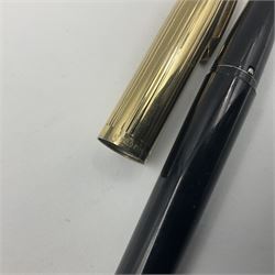 Sheaffer Crest fountain pen, the black barrel with gold plated cap and 18K nib, together with a matching ballpoint pen and further fountain pen, longest L14cm (3)