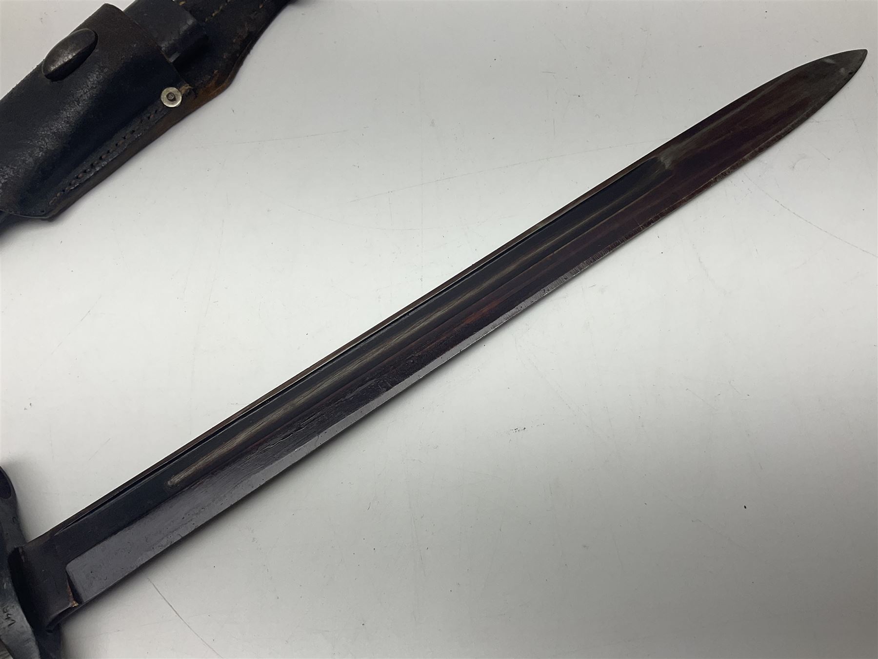 WW2 Italian Model 1891 bayonet with 30cm fullered blade; cross-piece marked PS 1941; in associated leather covered scabbard with frog L45cm overall