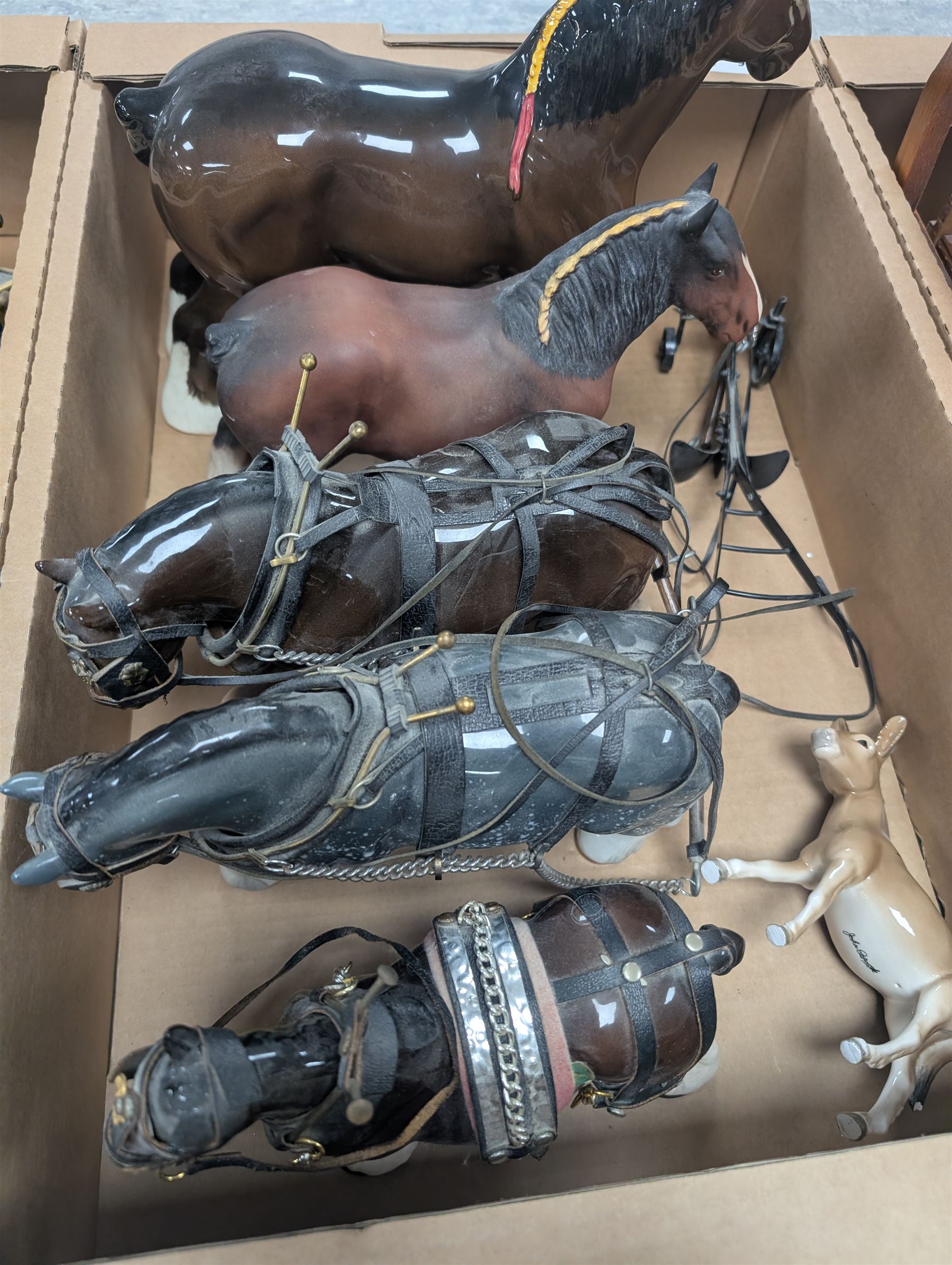 Collection of Shire horses, including Beswick and Sylvac examples, one with wooden cart and one with caravan, together with a Beswick donkey figure