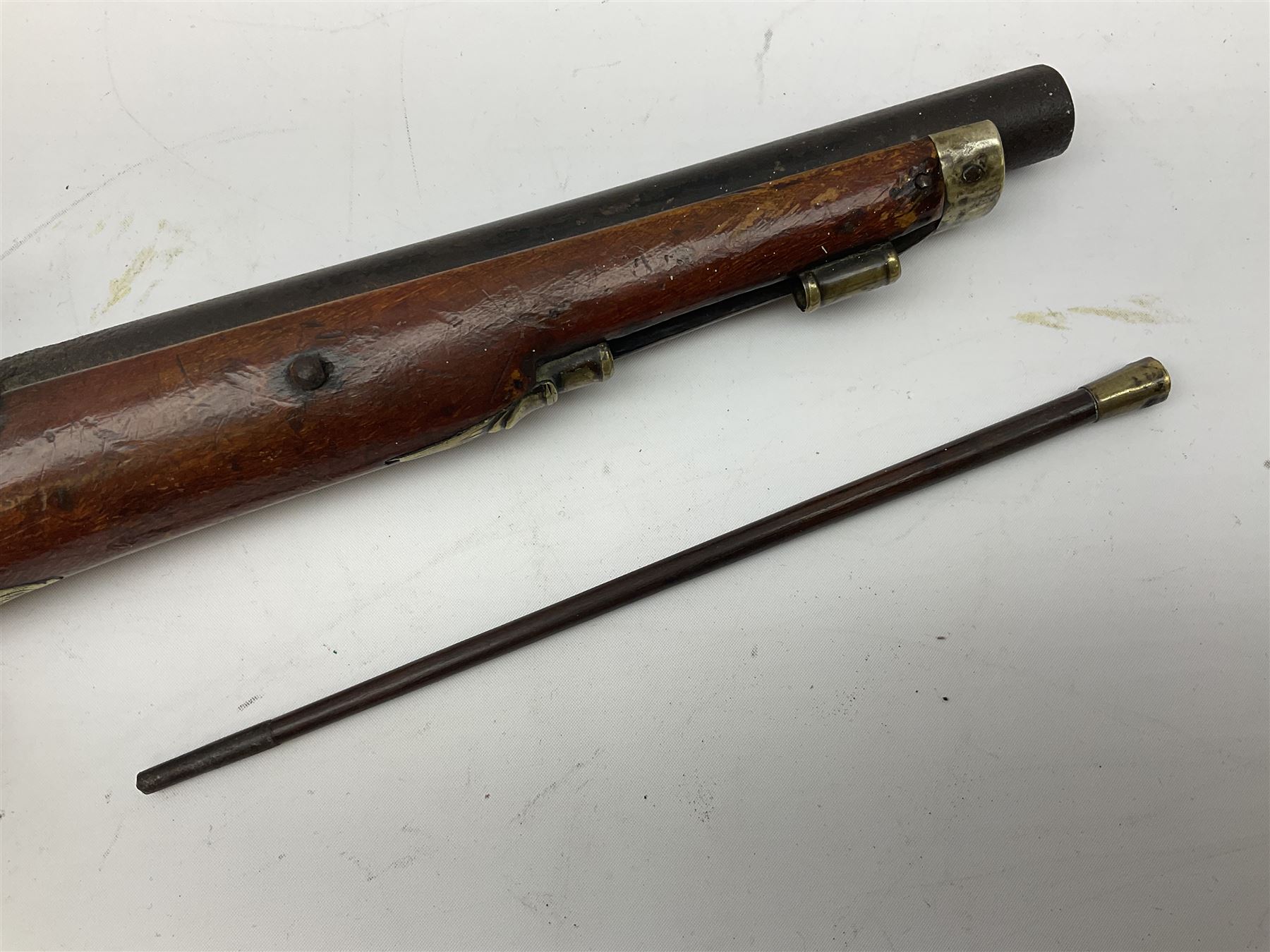 Re-manufactured percussion converted from flintlock single barrel pistol, the 20cm barrel with ramrod under, reused back action lock, brass furniture and hardwood stock L41cm overall