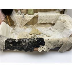 Collection of Victorian and later lace, to include a lace bonnet with floral detail, doilies, a selection of lace collars and cuffs, together with a black silk parasol, three porcelain pin cushion dolls, a suitcase, etc