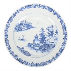 19th century Cantonese plate of octagonal form decorated to the centre with a garden of flowering peonies, together with two other 19th century plates and two serving platters each depicting temples in landscapes, octagonal plate W31cm  