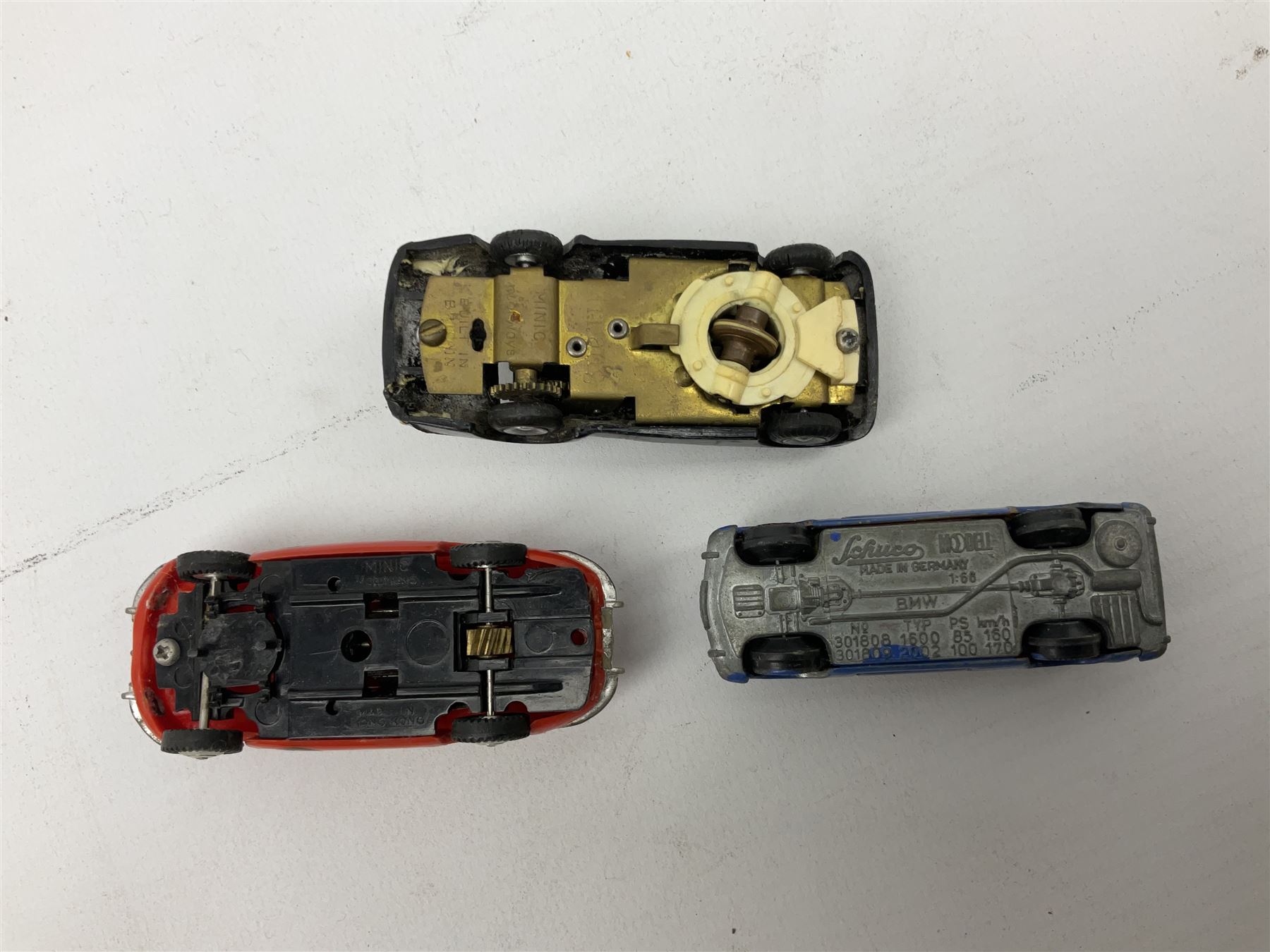 German Schuco Examico 4001 tin-plate clockwork model car with cream body work, steering wheel and gear stick; repainted Schuco die-cast BMW; three Minic Motorways cars; and three Scalextric Formula 1 racing cars; all unboxed (8)