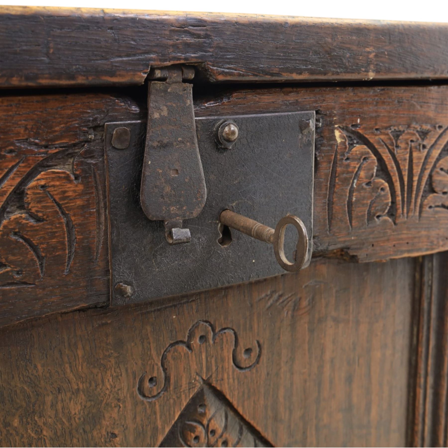 18th century style oak coffer, panelled rectangular top hinged to reveal storage with candle box, carved frieze and front panels, raised on stile feet