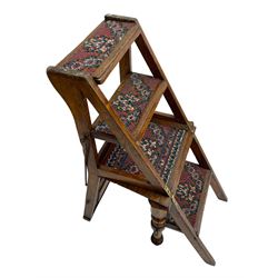 19th century oak metamorphic library steps and chair, panelled back with turned spindles over plank seat with turned front supports, the hinged seat folding forward, the steps inset with carpet treads  