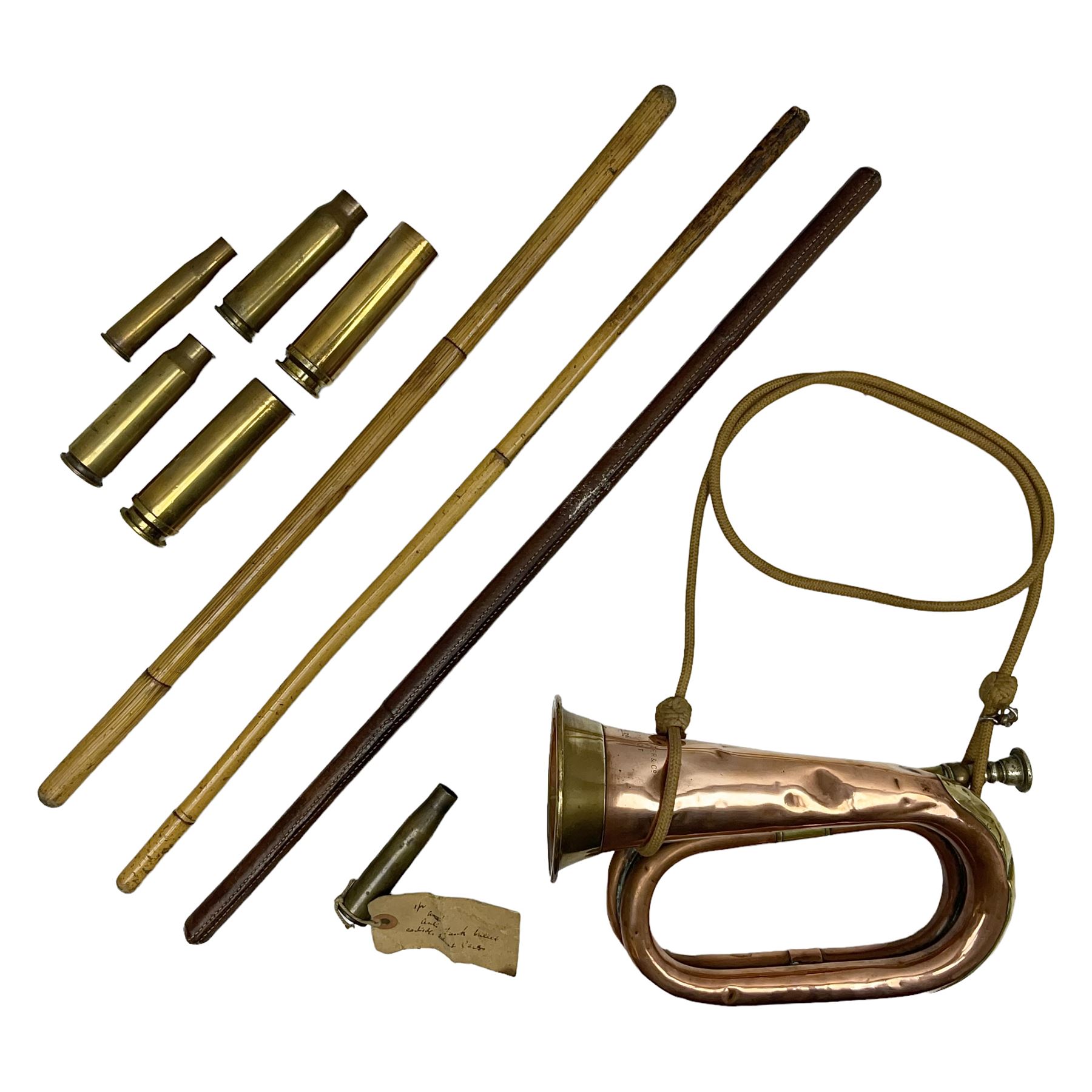 WW2 copper and brass bugle inscribed George Potter & Co, Aldershot 1939 L28cm; two cane and one leather covered swagger sticks; and three small pairs of plain brass shell cases (10)