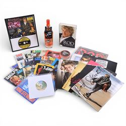 Signed bottle of Rod Stewart edition Wolfie's blended scotch whisky, together with Rod Stewart memorabilia, including first edition of his autobiography, colour photograph and two 7 inch singles, DVD sleeve 'Rod Stewart Live at Royal Albert Hall' signed by both Rod Stewart and Penny Lancaster, framed, tour programmes including 2019 world tour and a collection of Fan Club magazines