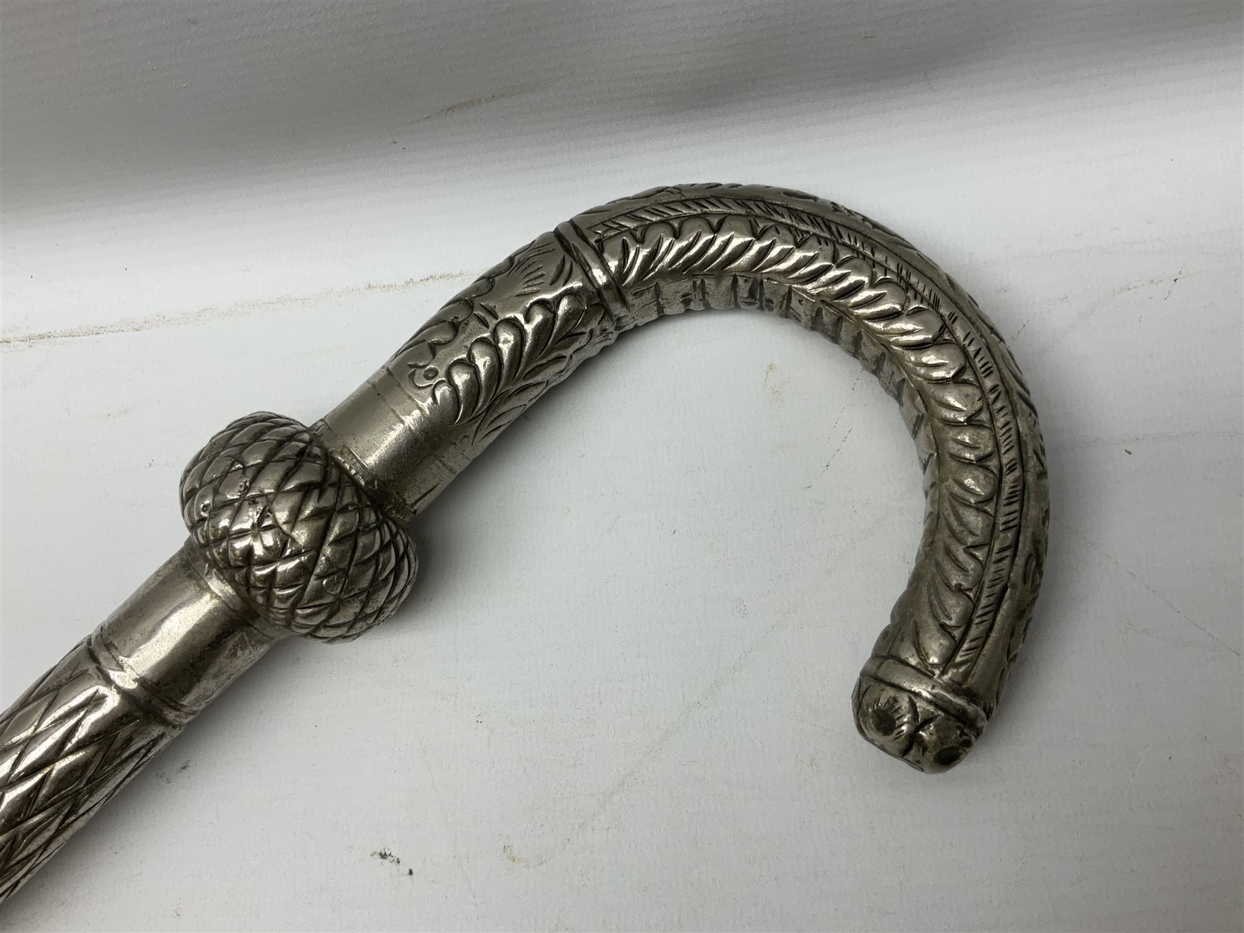 Reproduction non-firing flintlock pistol with brass skull crusher butt, the lock-plate inscribed 'Tower' and 'GR' L40cm; Sabre Japan Original Bowie Knife in sheath; and Indian embossed nickel two-piece walking cane (3)