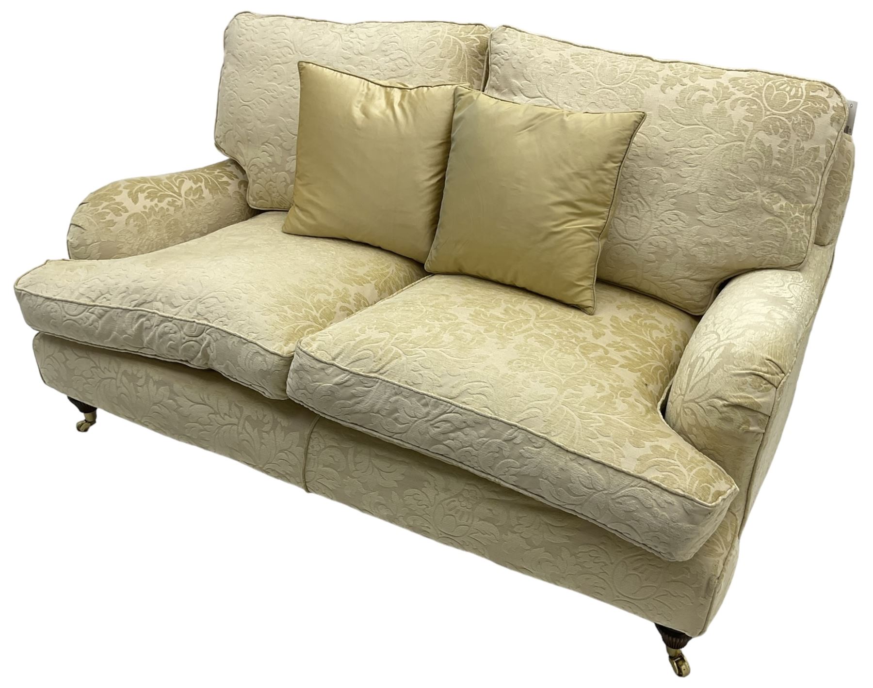 Multi-York - Howard shape two-seat sofa, upholstered in scrolling floral pattern loose covers, rolled arms, on turned front feet with brass cups and castors