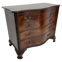Chippendale design serpentine chest, shaped moulded top carved with repeating flower head motifs, fitted with brushing slide over four graduating drawers, pierced and foliate moulded handle plates with scrolled swan neck handles, canted upright corners carved with flower heads and strapwork, on canted ogee bracket feet