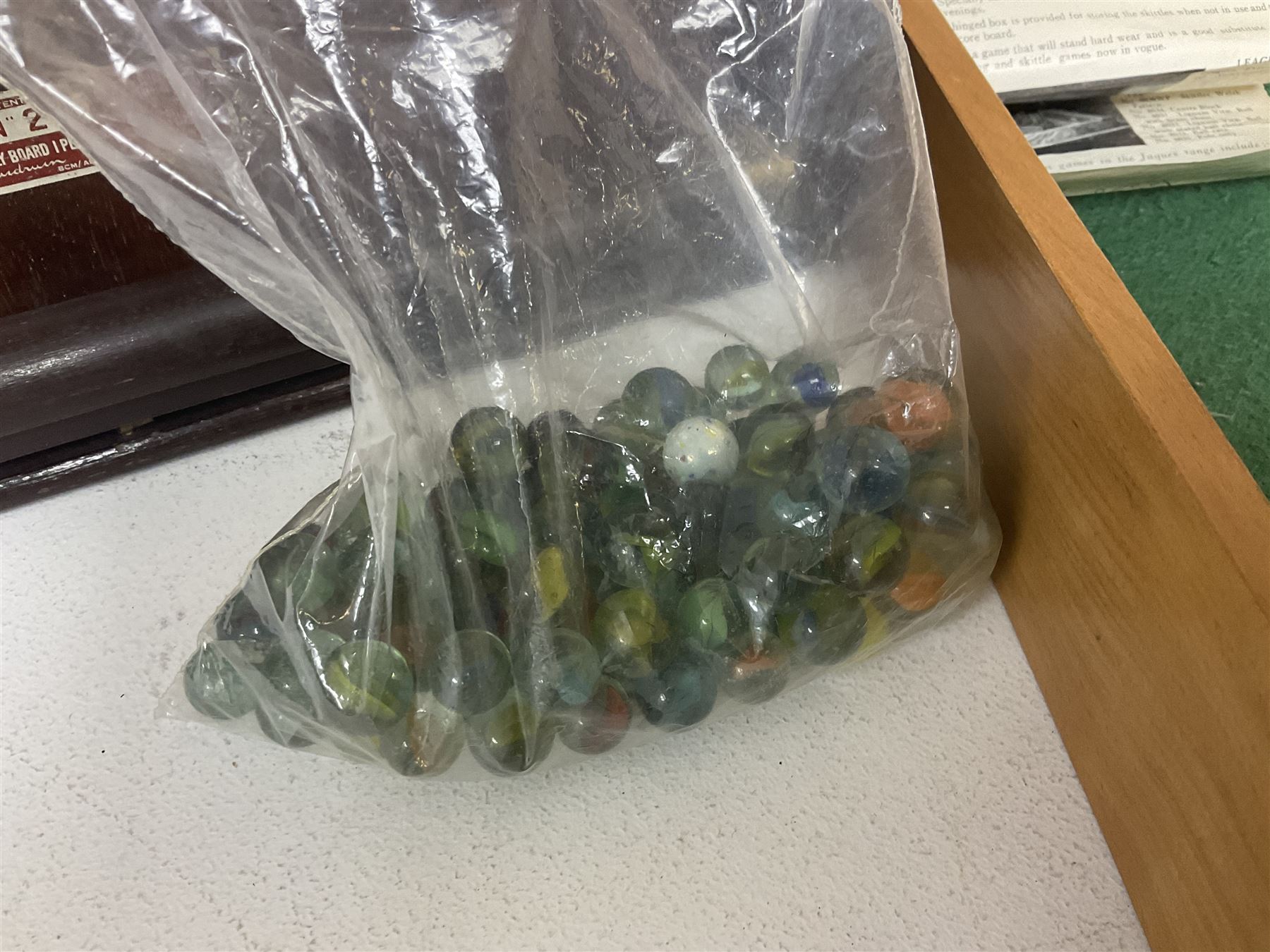 John Jaques and Son ‘Devil Among the Tailors’ wooden vintage skittles game, missing pole and ball, with instruction manual and original box; and a Corinthian Bagatelle board with marbles and push stick 