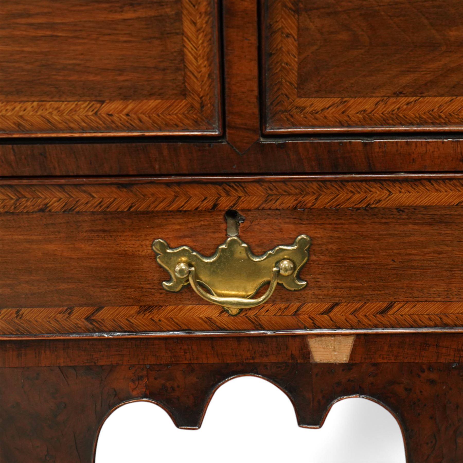 William and Mary design 18th century walnut and yew wood dresser or console table, rectangular canted top with feather banding and moulded edge, over two long and three short cock-beaded drawers, flanked by chamfered uprights above a shaped and cock-beaded apron, raised on six turned and tapering supports united by a shaped box stretcher, on lobed feet 