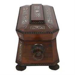 Tea caddy of sarcophagus form, inlaid with mother of pearl decoration,  the hinged lid opening to reveal two covered compartments, H24cm 