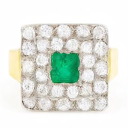 18ct gold emerald and diamond cluster ring, single octagonal cut emerald of approx 0.60 ca...