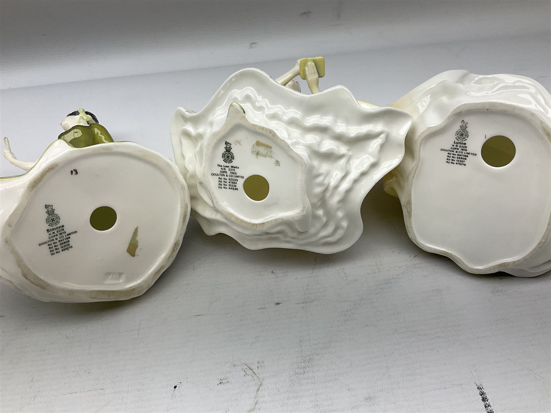 Three Royal Doulton figures comprising The Last Waltz, Simone and Lynne