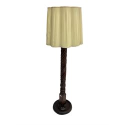 20th century mahogany standard lamp, the rope twist column turned and carved with acanthus leaves, on circular base, with shade