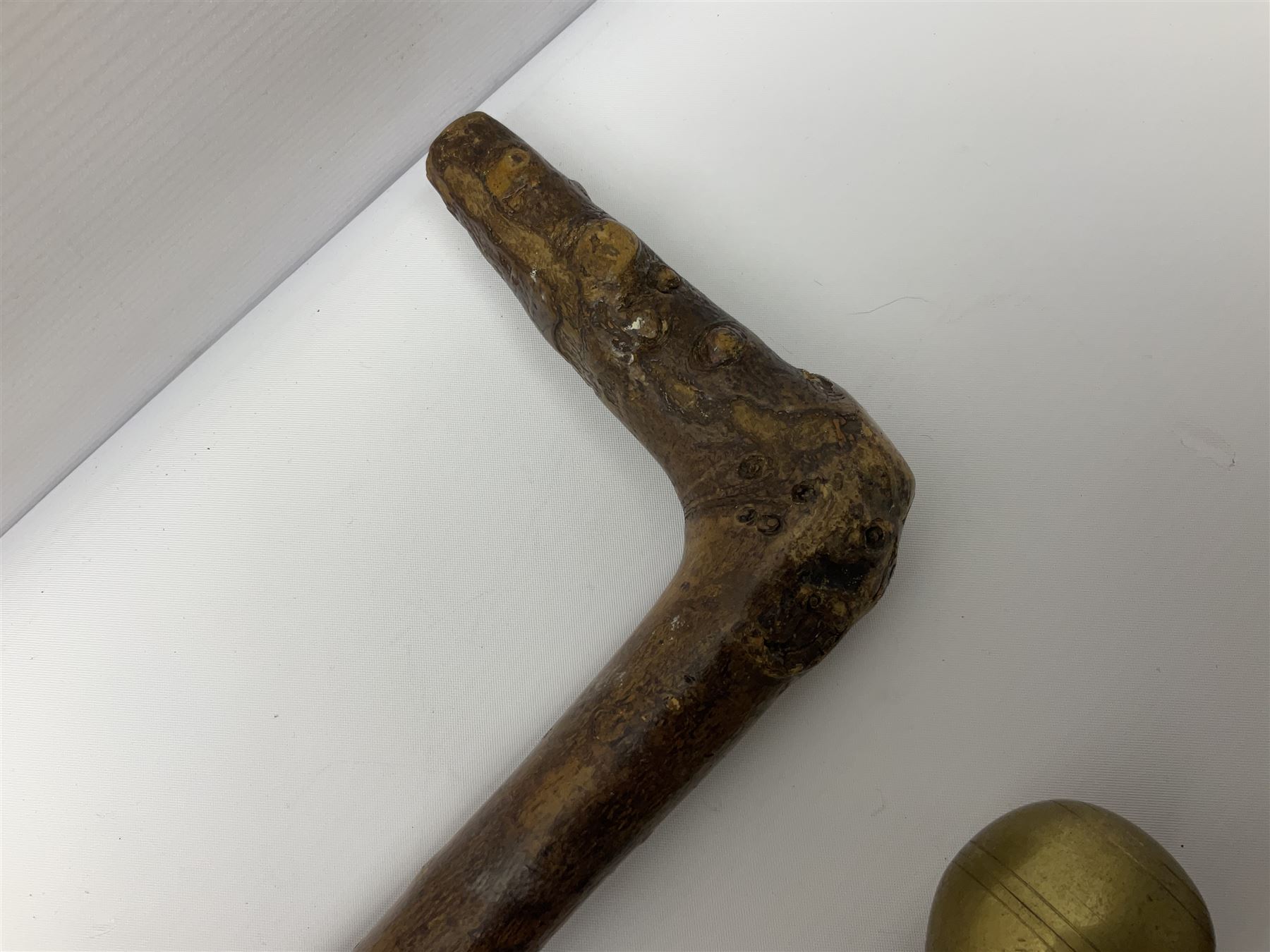 Four wooden walking canes, including a carved mahogany snooker cue example, tallest H86cm