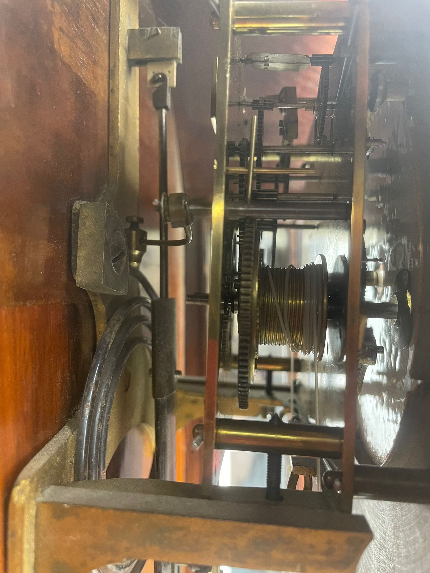 Lenzkirch – 8-day walnut cased weight driven Vienna regulator manufactured 1877-1878, with a break-arch pediment surmounted by a turned finial on a raised cavetto molding, fully glazed arched  door flanked by long ring turned pendants, flat base with open fretwork and two short pendants,  two piece enamel dial within a brass slip, Roman numerals, minute track and pierced steel hands, wooden pendulum with a brass faced bob, two brass cased weights and pulleys, dead beat escapement with a rack striking movement sounding the hours and half hours on a coiled gong, movement serial number 421410. 
Lenzkirch were one of Germanys most highly respected clock manufacturers of the 19th century, founded in the late 1850s the company produced movements and cases of high quality up until 1932.
