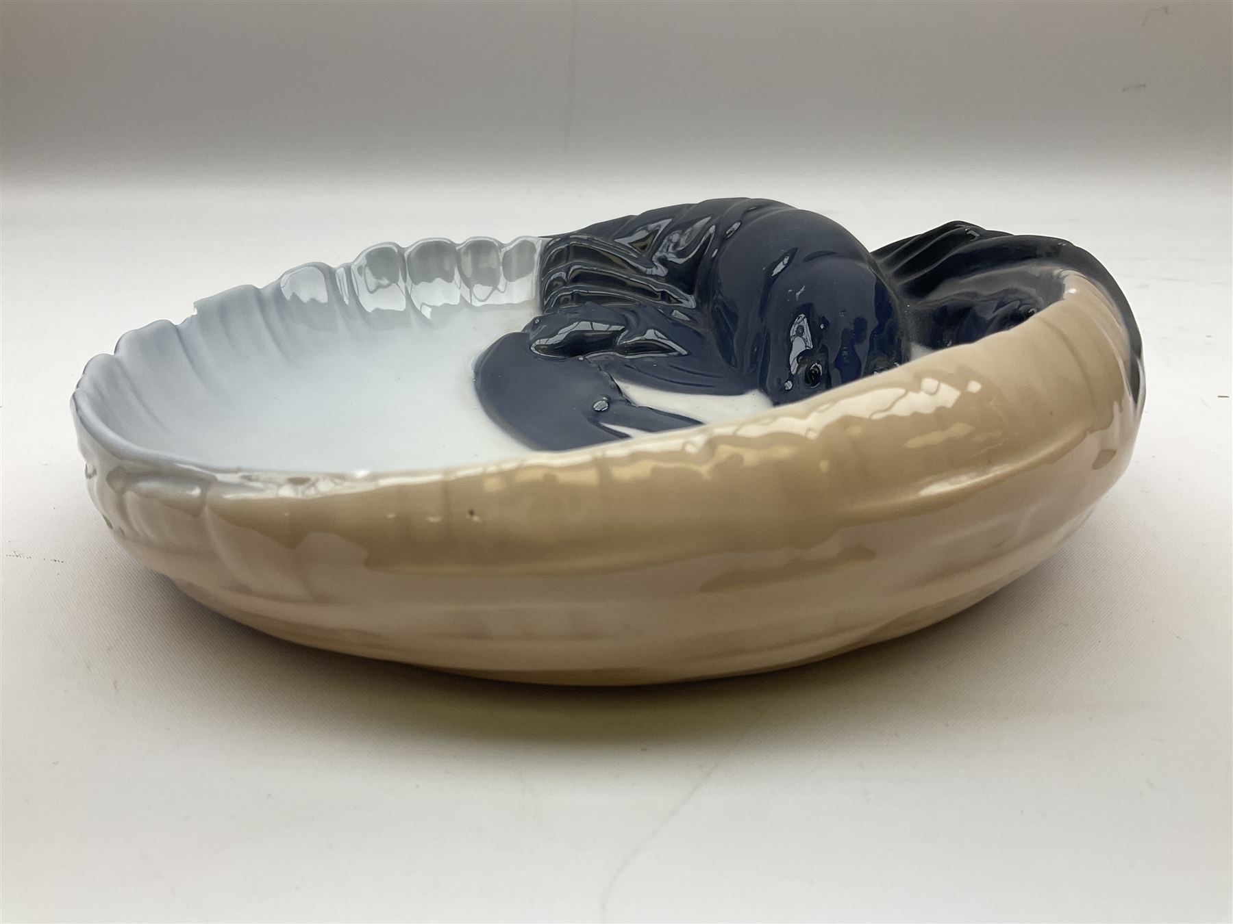 Pair of Royal Copenhagen bowls modelled as baskets and mounted with lobsters, model no 3498 and 3277, with painted and printed marks beneath, largest D19cm