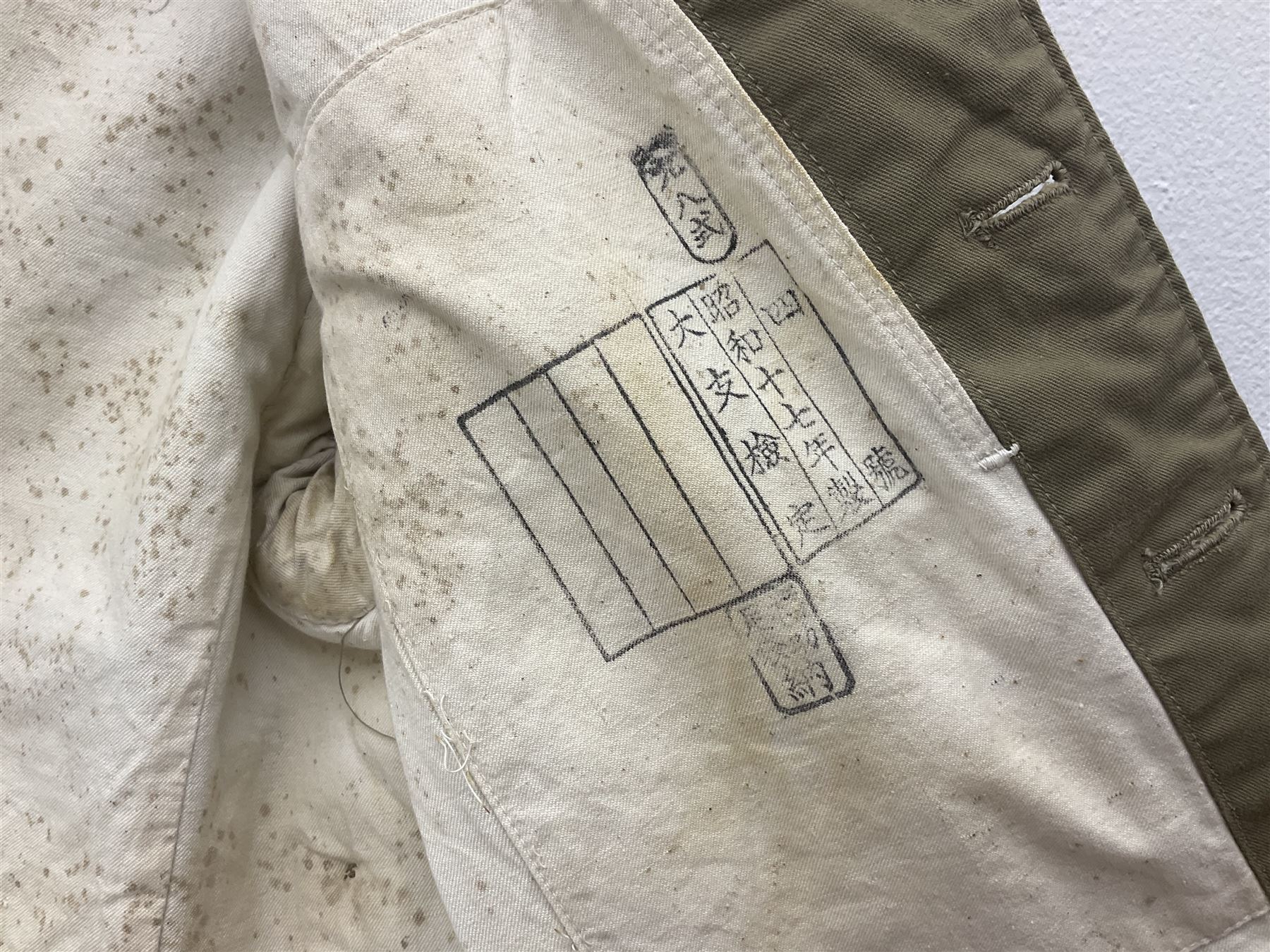 Japanese Type 38 winter tunic, the lining stamped with various Japanese character marks