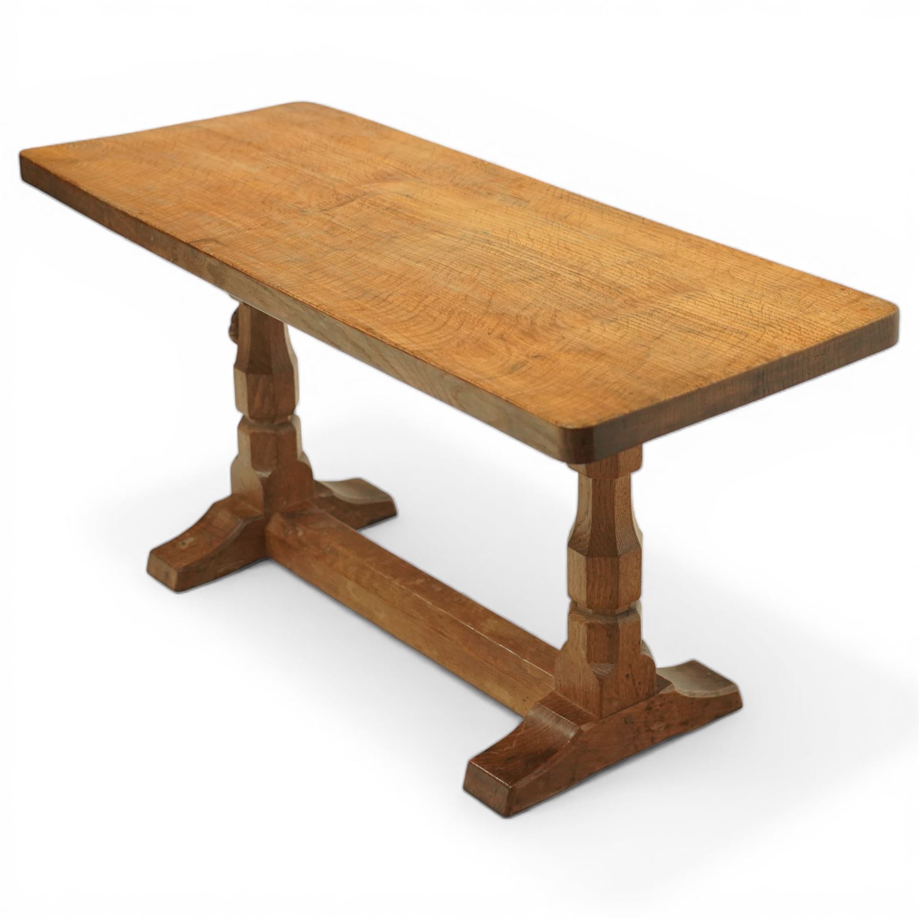 Mouseman - oak rectangular adzed coffee table, octagonal supports united by stretcher terminating in sled feet, with carved mouse signature, by the workshop of Robert Thompson of Kilburn 