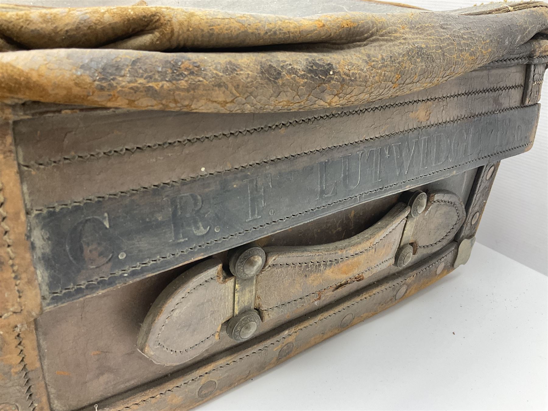 19th century leather suitcase, with brass plaque to cover engraved 'C R F Lutwidge Esq', the pink silk and white kid leather interior with pouch and edging impressed with gilt lettering reading 'By Appointment of Prince of Wales J W Allen 37 Strand Maker Prize Medal Awarded', H21cm, W73cm, Notes: Charles R. Fletcher Lutwidge, was mayor of Tunbridge Wells between 1895-1898, and again between 1901-1902