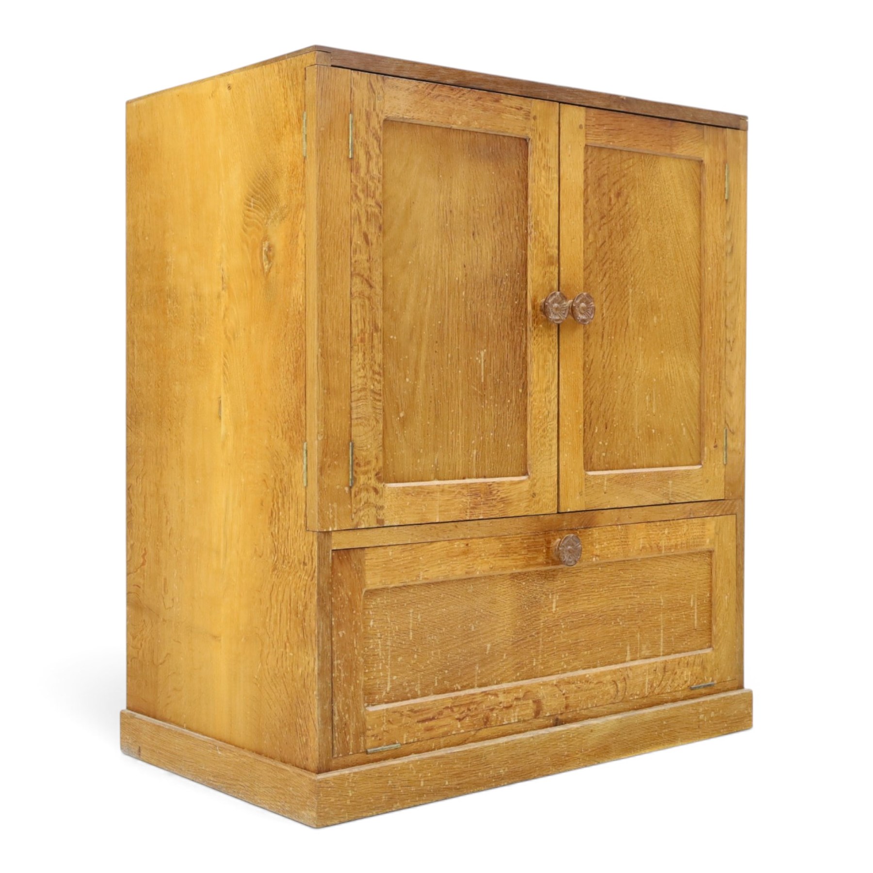 Lizardman - adzed oak media cabinet, adzed rectangular top above twin doors enclosing a shelved interior, above a fall front drawer, Yorkshire Rose carved handles, raised on castors, with carved lizard signature, by Derek Slater of Crayke  