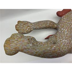 Helen Skelton (British 1933 – 2023): Two carved wooden abstract sculptures, one modelled as a dog, the other modelled as a bear, both with painted stippled decoration, largest H20cm. Born into an RAF family in 1933 in Kent and travelled the world extensively during her childhood. After settling in Bridlington, Helen immersed herself in painting, textiles, and wood sculpture, often inspired by nature's beauty. Her talent was showcased in a one-woman show at Sewerby Hall and recognised with the sculpture prize at Ferens Art Gallery in 2000. Sadly, Helen’s daughter passed away from cancer in 2005. This loss inspired Helen to donate her sculptures to Marie Curie upon her passing in 2023.