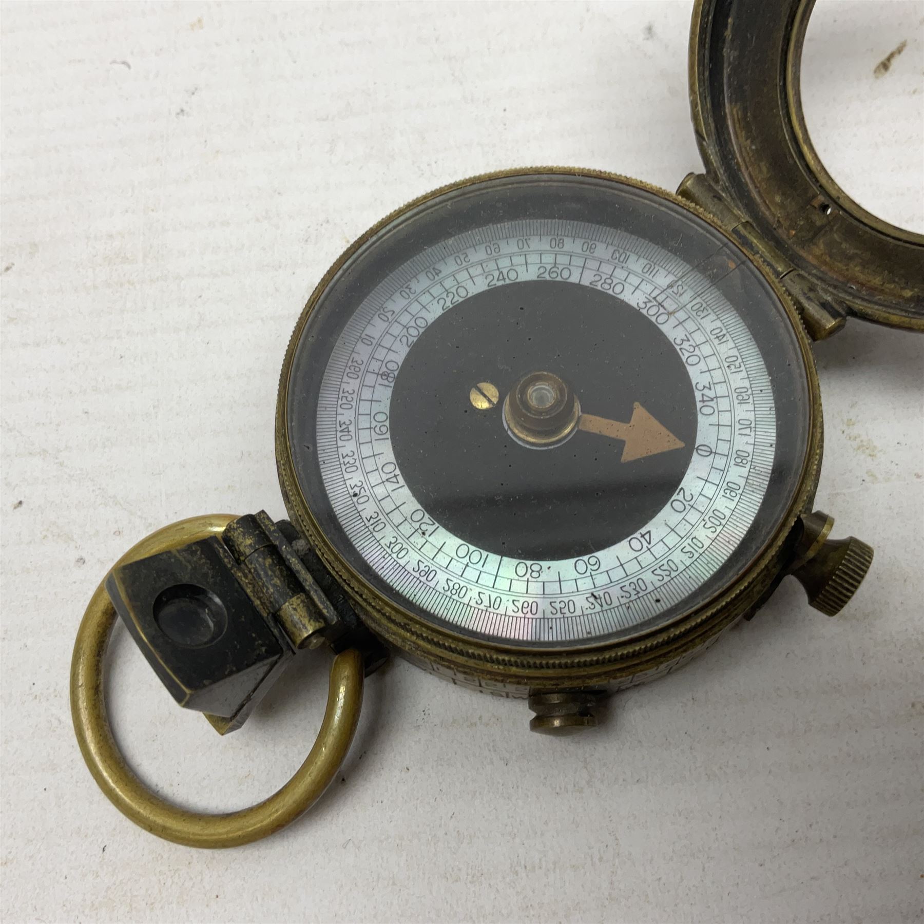 Broadhurst Clarkson brass and leather 4-draw telescope, the first draw with graduations, sliding lens shroud and leather covers for both ends on shoulder strap; marked 'Broadhurst Clarkson & Co. Ltd. 63 Farringdon Road London E.C.', L87cm fully extended; together with a WWI brass marching compass marked F-L No.123113 1918 (broad arrow); crudely etched L.H. McD. Latham; in associated Brooks & Co. leather case dated 1913 stamped W.B. Constable (2)