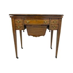 Edwardian inlaid mahogany games or work table, rectangular fold-over top inlaid with stylised dragon ivorine decoration and stringing, fitted with one long flanked by four small drawers over sewing compartment drawer, raised on square tapering supports with castors