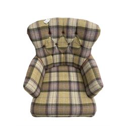 Traditional shaped armchair, upholstered in deep buttoned purple tartan fabric with red piping, raised on turned and tapering stained beech supports