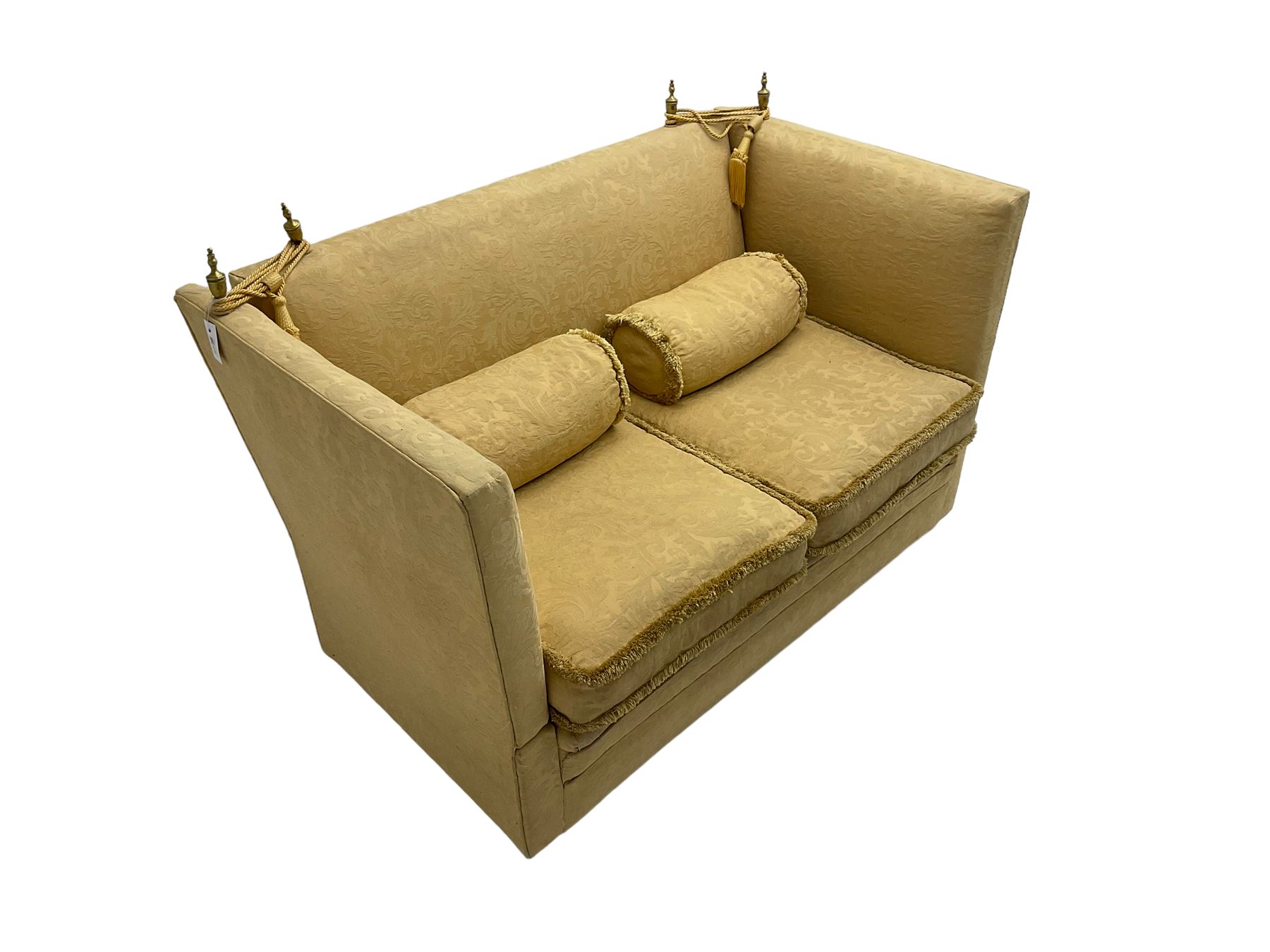 Edwardian knole design drop-arm two seat sofa, upholstered in yellow damask fabric with sprung back and seat and matching bolster cushions
