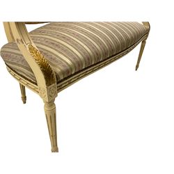 French cream painted salon sofa, gilded detail, upholstered in stripe fabric