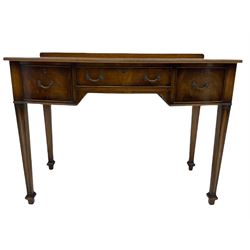 Georgian style mahogany bow front writing table, fitted with three drawers, square tapering moulded supports with spade feet