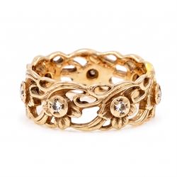 14ct rose gold diamond set band, pierced floral band set with seven round brilliant cut diamonds, stamped 14k