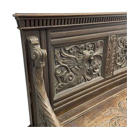 19th century oak hall bench, dentil cresting rail over moulded frame with panelled back carved with fire-breathing mythical beasts and central acanthus leaf motif, scroll carved down-sweeping arms carved with grotesque masks with scrolled foliage and shells, hinged box seat carved with scrolling foliage over panelled front with further carved foliage decoration, on paw carved front feet 