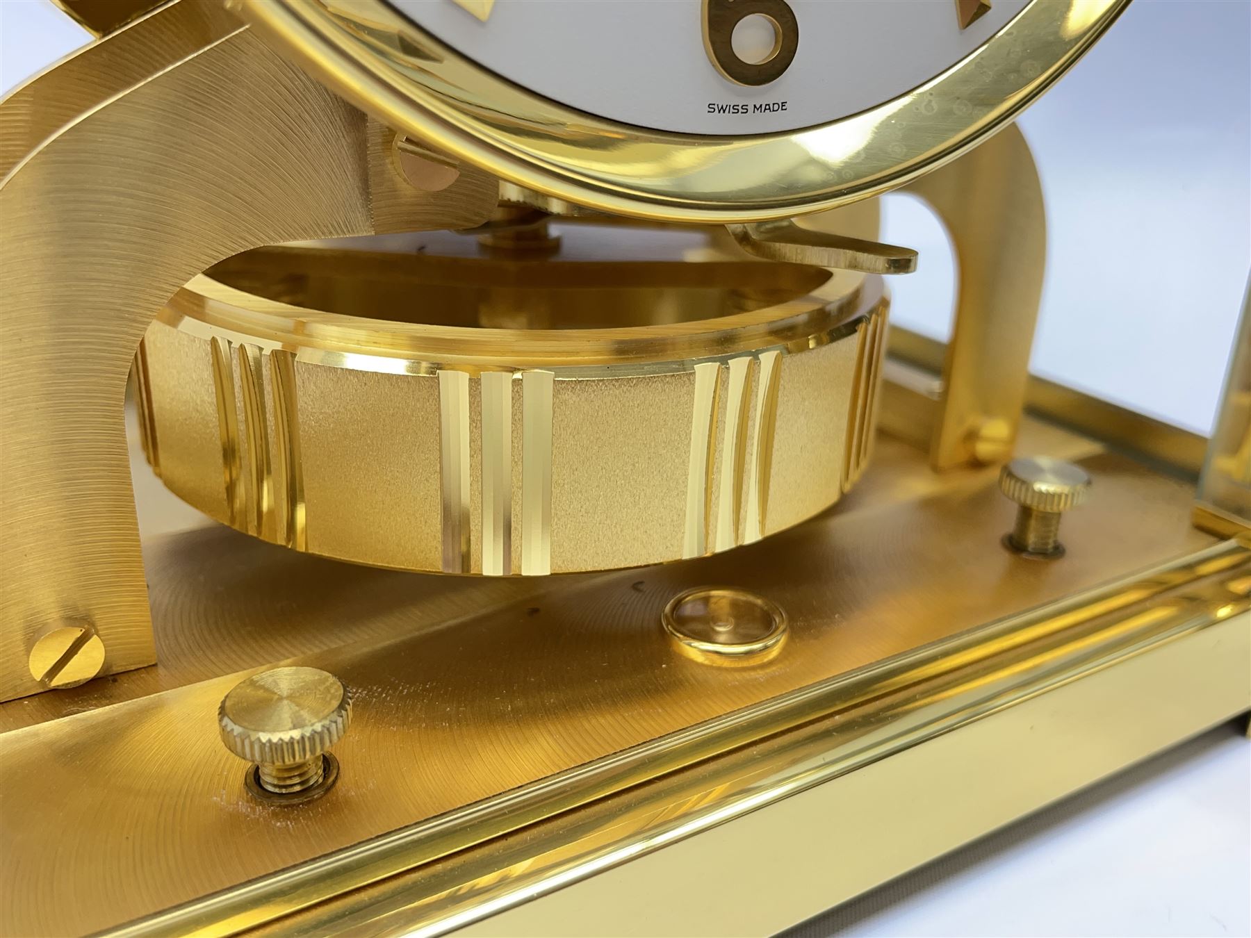Jaeger-LeCoultre Atmos timepiece clock, in gilt brass and glass case, with wall mount, serial number - 444966